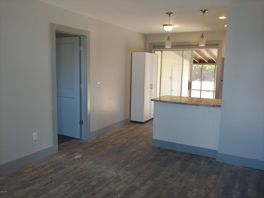 MOVE IN READY   House is newly renovated down to the studs. New central HVAC and duct work, new cabinets, flooring, water heater...its all new. This home has an attached storage area, New roof, New windows, large yard and large screened in back porch. Indoor laundry room, new stainless steel appliances...the list goes on and on.  Call for an appointment to view.  Private financing available with 20% down.