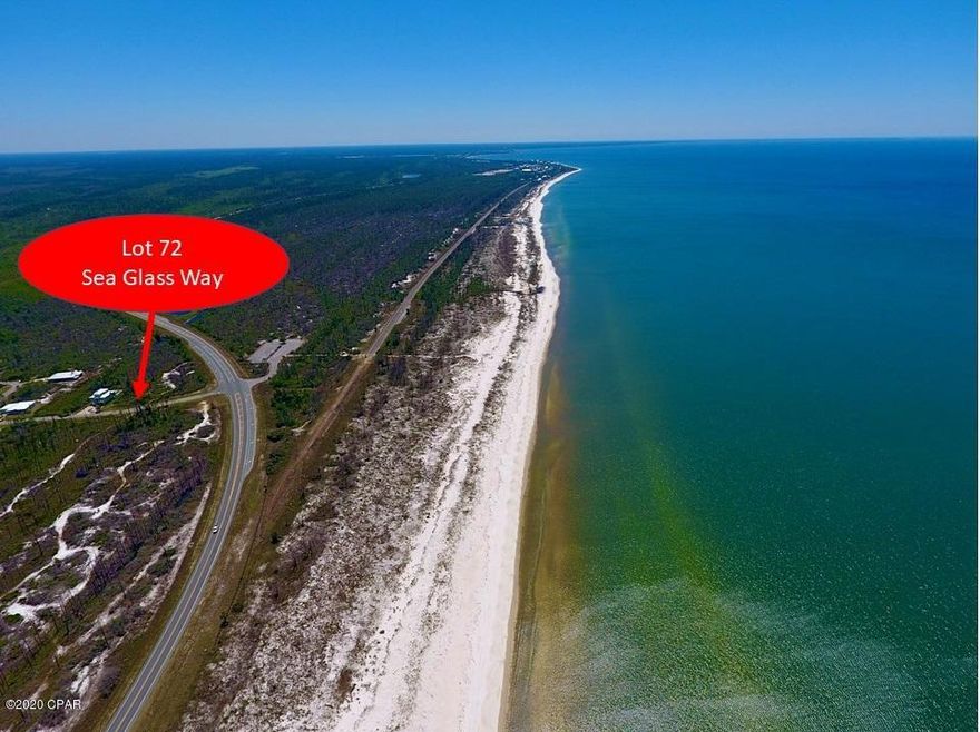 Reduced! Great location in Sunset Village. Build up on this lot to enjoy a Gulf View and Evening Sunset. This .25 Acre lot is the first lot on right in Sunset Village and will offer views 24/7. Take a good look at what it has to offer. The land between this lot and the highway is a buffer zone, so the entire front, side and back of home could offer exceptional Gulf Views!!! Sunset Village is a 90 lot community, with winding paved streets and street lamps. Underground utilities and several conservation areas withing the community. Across the street is the Beach Access and bike/walking trail (which was the Old Hwy 98). Miles of beach to explore and sunsets to enjoy.