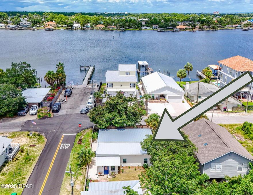 UNDER CONTRACT - ACCEPTING BACKUP OFFERS!

There simply isn't a better home in PCB... Less than 100 feet to the Bay, less than 4 blocks to the Gulf, over $60k in updates, one of the most desirable locations on the East end of the beach, and one of the absolute lowest priced homes available. Blink and you'll miss this once in a lifetime steal!!! 

This incredible Beach Bungalow is located directly across from the Dolphin Boat Ramp on Grand Lagoon, and it offers incredible water views!  This unbelievably well maintained block home has received countless updates (impact resistant windows in 2019, trusses and roof in 2022, all new master bathroom in 2022, HVAC in 2023, new septic in 2019, and the list goes on! 

Although this cozy beach home offers an amazing layout with 2 bedrooms, 2 bathrooms, an open living room and kitchen, a separate dining room, an incredible den, and a unique reading area/office with natural light peacefully flowing throughout - the outside living area is where this bungalow truly shines...

From the expansive front porch with water views, to the meticulously manicured backyard, you are guaranteed to have more than enough room for entertaining family and friends. And for those day's when you just want to tune out the outside world and relax, you won't find a more quite and peaceful location so close to the water.

No matter if you are an avid boater, an RV'er, or if you enjoy a peaceful day of fishing or kayaking, the amazing workshop and backyard offers more than enough room for you to store every toy your heart could desire!

This home exceeds all expectations, and is close to all the best that PCB has to offer (dining, shopping, live music, the Bay, the Gulf, and everything in between), yet it is perfectly situated in one of the most peaceful communities around. 

Go look at all the other homes available. Don't just look at the pictures, we ask that you  actually go out and truly ''feel'' the home, you breathe in the air, and you experience the community. Then... come be our guest and experience a level of perfected living you never knew was possible.

Welcome Home!!!