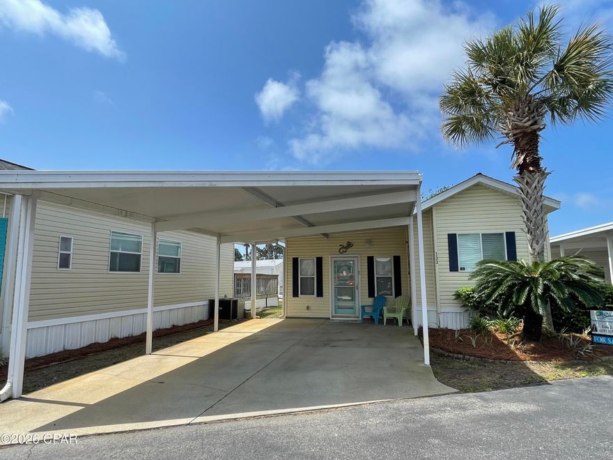 This beautiful 2-bedroom, 2-bath bungalow is the perfect beach home. This home has fully equipped kitchen with a breakfast bar, a large addition living room and a large, screened patio on the back. Recent updates include all new stainless steel appliances, backsplash, quartz countertops, new kitchen sink and faucets, new shower, new countertops, sinks and vanities in both bathrooms. New queen mattress and topper. Blue tooth audio surround, Four camera blink security system. Freshly painted, painted cabinets and hardware, beautiful vinyl plank flooring throughout. Most furnishings included. (see list in documents of items that convey) The home has a covered awning for parking of two vehicles. Emerald Pointe Resort is gated, golf cart friendly, pet friendly community located 3 miles from St Andrews State Park. Convenient to restaurants and shopping. Amenities include 2 pools (one seasonally heated) hot tub, large clubhouse, exercise room, lake with boardwalk and shuffleboard court. HOA fee includes water, sewer, garbage, High speed internet and lawn service. Call for a showing today. All information including age, square footage, lot and room sizes is approximate. Verify if important.