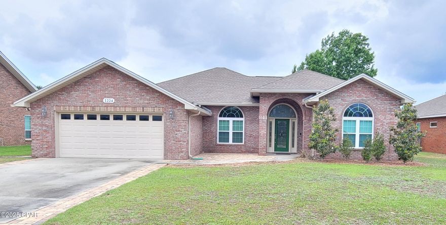 Lynn Haven! Beautiful Custom Brick Home! 4 bedroom 2.5 bath 2 car garage on large privacy fenced lot, front courtyard sitting area, large back patio with ceiling fan overlooking the backyard. This home features an elegant open floor plan with tall ceilings, recess lighting, electric window blinds, foyer, living area, dining area, kitchen with granite countertops, oak cabinets, breakfast bar, bonus room with door that leads to the back patio, laundry room with washer, dryer, utility sink, cabinets, front bedroom could be used for home office, 1/2 bath off foyer, split bedroom plan with master bedroom that has a tray ceiling, ceiling fan, electric blinds with remote, carpet flooring, master bathroom has HIS & HER closets, jacuzzi tub, open walk-in shower, double vanity, main bath with double vanity, LVP, Tile & Carpet flooring, garage has shelving, work bench, tool pegboard wall, air compressor, riding lawn mower, push mower, extra refrigerator and 3-Way Split for keeping the garage climate controlled.
W/D, push mower, riding mower, air compressor, wall art, foyer table, wall mirror and jacuzzi tub, garage refrigerator 'AS IS'. 
Fireplace is non-operational.
NO PETS!