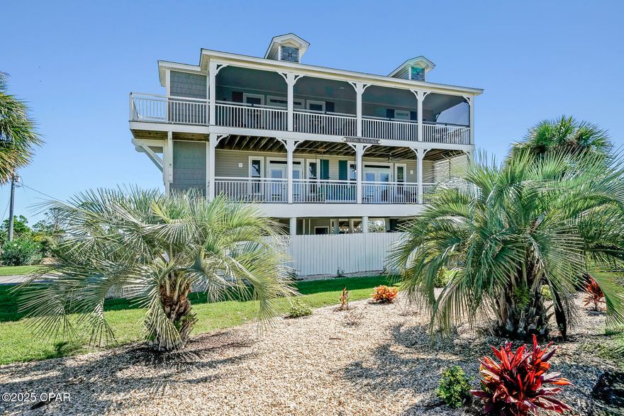COASTAL LUXURY WITH BAY & GULF VIEWS — PLUS PRIVATE ACCESS TO BOTH. This stunning 3-bedroom, 3-bath residence is perfectly positioned on a rare half-acre lot offering the best of both worlds: sweeping views of the Gulf of Mexico to the south and the peaceful waters of St. Joseph Bay to the north. Located in X flood zone, an area not requiring flood insurance, this well-appointed coastal residence features an enclosed elevator for comfortable, convenient The spacious open-concept layout is ideal for relaxed gatherings and easy entertaining. Sun-filled interiors flow seamlessly onto wraparound porches, inviting you to enjoy morning coffee, coastal breezes, and ever-changing water views. The bright living area offers comfortable seating and direct balcony access, while the kitchen is equipped with granite countertops, stainless steel appliances, and ample workspace—perfect for preparing fresh-catch dinners. Outdoor living shines here, with multiple areas designed for relaxation, including screened porches overlooking the water and lounge spaces surrounded by lush coastal landscaping. A standout bonus is the detached, climate-controlled studio, offering abundant natural light and a flexible floor plan ideal for an art studio, private office, music room, or creative retreat. This property also offers dedicated private access to both the beach and the bay, placing endless outdoor adventures just steps from your door—whether it's long shoreline walks, kayaking on calm bay waters, or biking the scenic Cape trail. Perfect as a full-time residence, vacation retreat, or investment opportunity, this home delivers space, versatility, and a true coastal lifestyle. Life on Cape San Blas means sugar-white beaches, fishing and scalloping, pet-friendly shoreline adventures, and a relaxed small-town atmosphere. When you're ready to explore, Port St. Joe is just a short drive away with boutique shopping and local seafood dining. Call for your private tour and LIVE THE BEACH LIFE