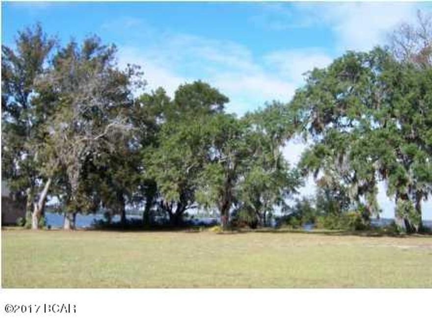 WATER FRONT PROPERTY in Lynn Haven ~ This beautiful lot is on the bay in Panama Country Club in Lynn Haven.  Waterfront lot with incredible bay views!   Panama Country Club offers a bay front clubhouse, championship golf course, pool, and park