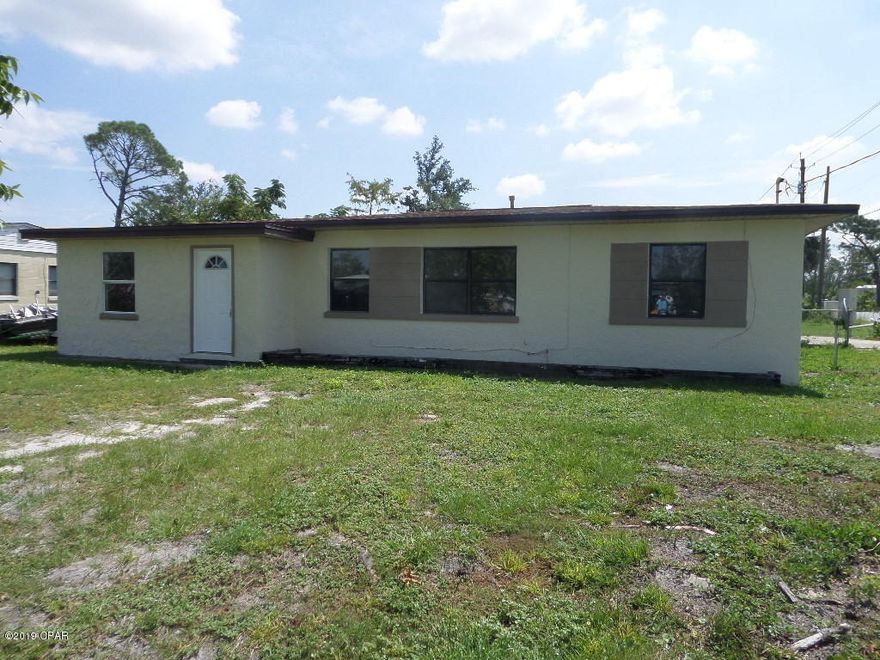 This spacious home is situated on a corner lot in the St. Andrews area of Panama City.  This home features 4 bedroom, 2 bath. Large family room with fireplace.  Just off the family room is  a nook that would be ideal for little office and storage. Tile flooring in the kitchen & dining area. Vinyl plank flooring in 3 bedrooms.  New shingle roof, New central heat & cooling system, fixtures & ceiling fans. Fresh paint on the interior and exterior. The home is still undergoing some repairs & improvements including new carpet to be installed soon.  Convenient to schools and colleges, shopping, restaurants,  parks and marina.