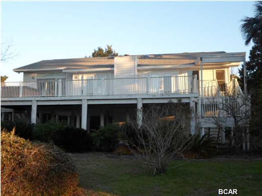 Here's your chance to own a waterfront home with gorgeous panoramic views of North Bay. Way ahead of it's time, the interior boasts an open-concept floorplan with beautiful hardwood cathedral ceilings, sky lights, glass doors and windows with waterfront views from almost every room. The Master suite is spacious, has a huge walkin closet and glass doors to the deck and hot tub. The dock provides room for your boat and the canal opens directly into North Bay. The landscaping is already done for you, complete with a water feature. There is even a 2 car garage, over-sized, so there is plenty of parking area. (All info/dimensions/etc, is approximate and buyer should verify anything that is important.)