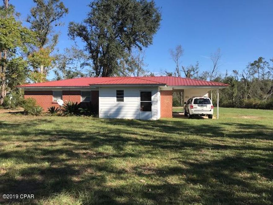 'CURRENTLY UNDER CONTRACT, SELLER ACCEPTING BACKUP OFFERS. Nice 2.64acre lot with 3Bedroom, 2Bath sound, brick home with one car attached carport, some updates needed.  Property lawn has been cut and cleared of storm debris, also trees have been cut down and removed.  Easy to show, call today!