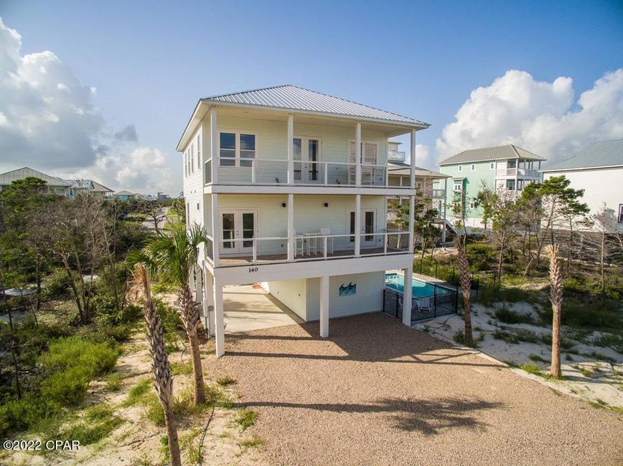 BEAUTIFULLY DESIGNED 5BR/5.5BA BEACH HOUSE W/GULF VIEWS, PRIVATE POOL & DEEDED BEACH ACCESS ON THE N CAPE! Newly constructed in 2020, the open concept main living/dining/kitchen space has a light & airy feel w/white shaker style cabinetry, shiplap walls & glass tile backsplash. Modern SS appliances, quartz counters & decorative lighting add charm & appeal. LVP flows seamlessly into multiple bedroom suites to accommodate guests, many of which are complete w/tiled shower stalls, double vanities & private balcony. A separate den, bunkroom & shared BA are an added bonus. Fully furnished & rental ready, this home features covered parking, an expansive deck space & is only steps to pet friendly white sand beaches. Cast your fishing lines & leave the crowd behind. Don't let this opportunity pass!