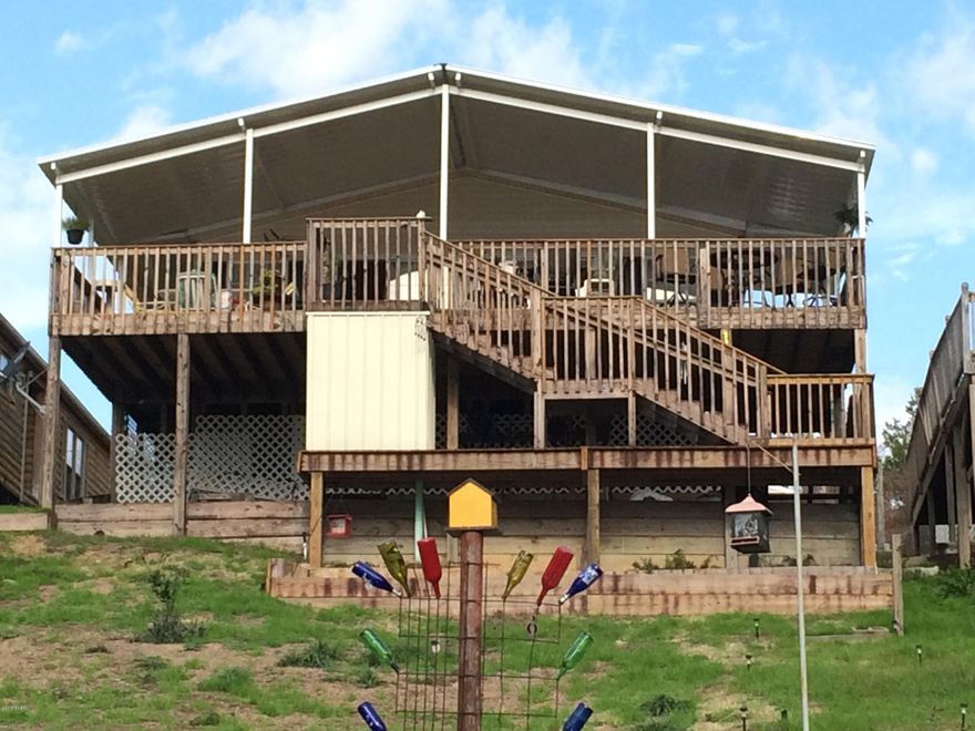 Looking for a Lake House that is move in ready? You have found it! This well maintained double wide on waterfront property at beautiful Crystal Lake! It features 3 bedroom and 2 baths and 1660 sq ft. The outdoor living space boasts 296 sq ft of new covered deck with access to front and back yard. This Bright and cheery home. It has a new metal roof and carport.The property can be purchased separately or as part of a package with MLS # 653982.