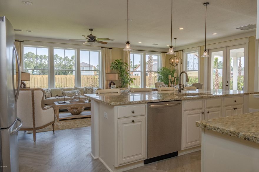 This home features the Amelia floor plan with a Coastal Elevation.

Samuel Taylor homes are truly one of the best constructed homes in Bay County. We build our homes with 2x6 exterior studs vs other builders using 2x4's. Not only is it a stronger home, but this also allows us to put R-19 in the walls instead of R-13.  We also use R-38 in our ceilings vs R-30 like most builders. We insulate most of the interior walls to make a very quiet home. SS appliance package is standard along with brushed nickel faucets, security system, 8 ft. doors throughout, granite counters in kitchen and baths, raised vanities with under mounted porcelain sinks, SS gas oven, oversized tiles, upgraded carpet with 8 lb. padding and much more. A craftsman style trim package adds to the character and uniqueness of our homes. Choose from 3 exterior elevations: Classic, Coastal, or Boat builder. Pick from traditional style garages or our detached garages with optional carriage home above, perfect for the college student, guests or in-law quarters.
   SweetBay offers biking and hiking trails, a boathouse to launch canoes, kayaks and paddle boards, a permitted marina, community pool (construction to start 2016), several parks, ponds, children's playground, planned township with a major grocery store and many shoppes. Everything is within a 5 minute walk or less.  University Academy is the center of this beautiful community. The Academy is the #1 school for math and reading for the Bay County District. Your children are automatically enrolled with purchase of a home. Currently there are over 800 on the waiting list to get in to the school. Come see what everyone is talking about!