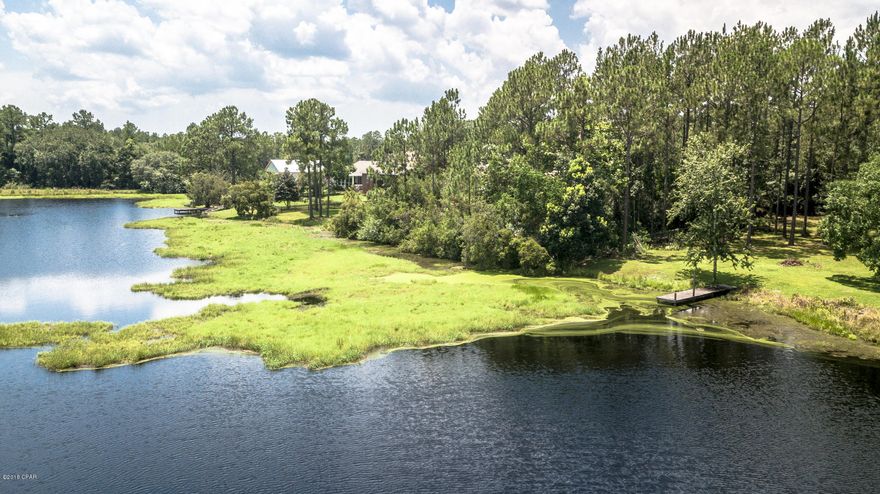 Waterfront lot in quiet neighborhood. Close to shopping, schools and Tyndall AFB. This .60 acre lot has approximately 115 feet of waterfront on a small, clean lake. Seller offering a $3,000 land clearing allowance with acceptable offer!