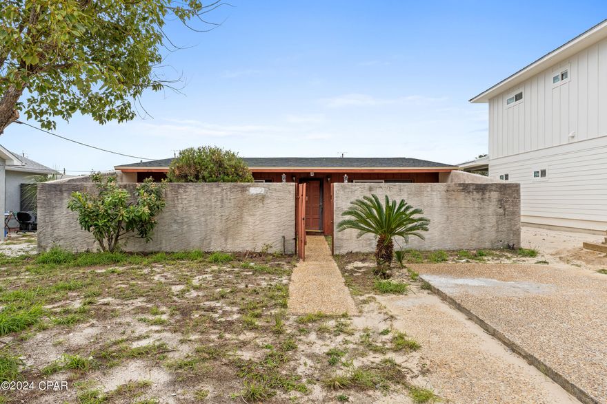 Looking for a project just two blocks from the beach? Look no further! This fixer-upper offers incredible potential for those with a keen eye for design and renovation. Whether you're an investor, first time homeowner or looking for a vacation home seeking a rewarding DIY experience, this property is ready to be transformed into a true gem. Property was hit by hurricane Michael back in 2018. Work has been done on property 2020 roof, drywall, new storm windows, water heater as well as sliding glass doors throughout the structure. This property just needs a little TLC and will make a great investment just minutes to the White Sandy Beaches of the Gulf of Mexico. Call today for a showing as this is priced right and won't last long!