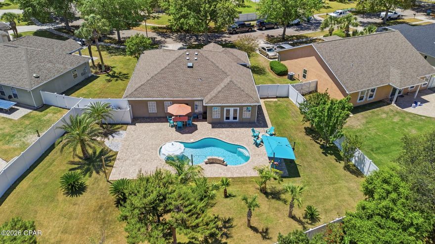 This is the pool home you don't want to miss!

Experience the ultimate Florida lifestyle in this meticulously upgraded 3-bedroom, 2-bathroom residence, perfectly positioned in a quiet, non-short-term rental neighborhood. Whether you are seeking a coastal primary residence or a private secondary vacation home, this property offers the rare combination of proximity to the action and the peace of a true residential community.

Interior Elegance & Versatile Living
Step inside a home that feels brand new, boasting a comprehensive interior refresh. The spacious layout is enhanced by crown molding (2023) and fresh paint (2022) throughout. Interior features include:

Modern Flooring: A tasteful blend of durable vinyl planks and plush carpet installed in 2022.

Chef's Kitchen & Laundry: Fully equipped with a 2023 appliance suite, including a new refrigerator, stove, dishwasher, washer, and dryer.

Flex Space: A dedicated office that can easily serve as a 4th bedroom or a custom hobby room.

Primary Suite Retreat: Featuring a bathroom remodel (2023) with new vanities, lighting, and a bright new skylight (2022).

The Backyard Oasis: The Best Private Pool in PCB
The exterior is a masterclass in outdoor living. The backyard was transformed in 2023 into a private resort, featuring:

Luxury Saltwater & Ozone Pool: Equipped with a waterfall and advanced heating and cooling capabilities for year-round enjoyment.

Entertainment Ready: An integrated Sonos outdoor sound system with rock speakers and a convenient outdoor shower.

Manicured Grounds: Professional landscaping, new sod, and privacy provided by a 2022 vinyl fence.

Efficiency & Peace of Mind
This home is as functional as it is beautiful, offering significant savings on utilities and peace of mind during those hot Florida months:

Major Systems: New roof (2021) and central AC (2021).

Energy Efficiency: A $7,000 value in foam attic insulation (2023) provides maximum efficiency.

Structural Protection: Fabric hurricane shutters (2023) and durable stucco siding.

Financial Benefits: Property taxes and insurance are extremely affordable.

Unbeatable Location
Location is everything! You are situated directly across the street from Pier Park, offering world-class dining, shopping, and entertainment, and you are less than one mile from the sugar-white sands of the Gulf of Mexico.

Schedule your private showing today to experience this turnkey coastal gem!