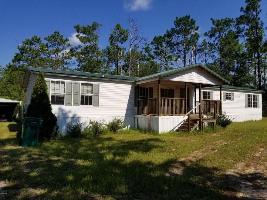 'CURRENTLY UNDER CONTRACT, SELLER ACCEPTING BACKUP OFFERS' This 3 bedroom, 2 bath house is located in Leisure Lakes, a security gated subdivision that offers lots of amenities. This home on 2.15 acres is flat and on a corner. It has a covered front porch and a covered back porch and a metal roof. There is new flooring in the kitchen, den, dining room and living room. It has a cathedral ceiling with many ceiling fans. It has a 12 x 24 metal shed with a 2-car carport and an additional metal storage shed. Part of the back yard is fenced for kids and pets, it has an above ground pool, and part of the property is wooded for privacy. Amenities include 2 lakes, boat launch, swimming pool, basketball court, tennis court, toddler playground, weight room, rental kitchen, covered pavilion.