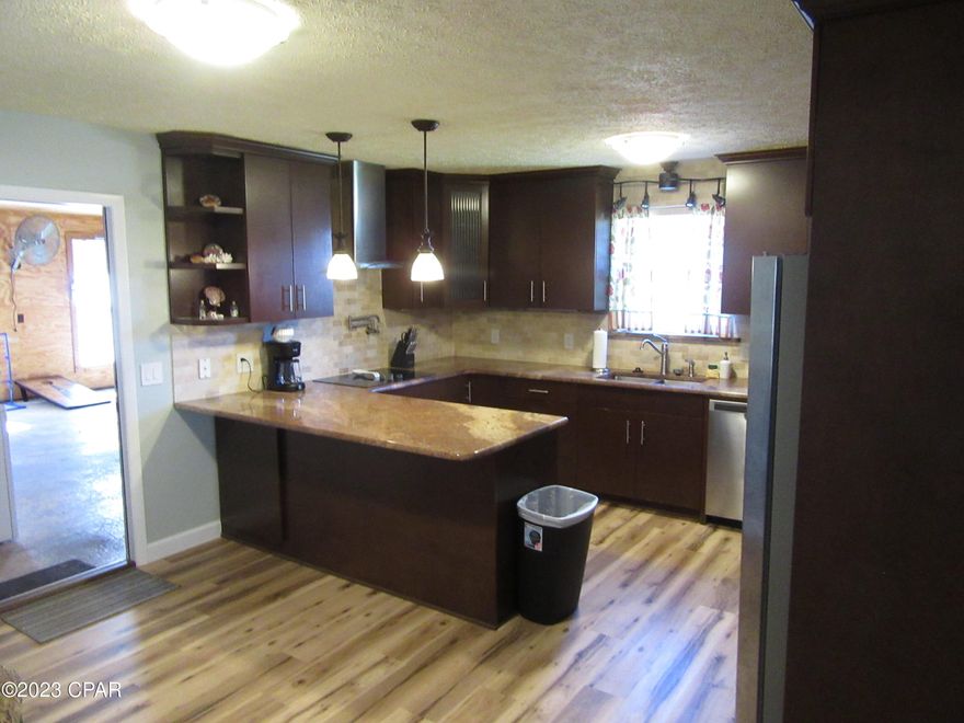 Location Location  very nice, renovated home close to the beach and water activities. less than a year on renovations, home is move in ready, tiled showers, plank vinyl., granite counters with all new cabinets, new a/c system, owner did a very nice job on renovations. can be a short-term rental or second home, it sits on a double lot. for privacy put this on your short list it wont last long