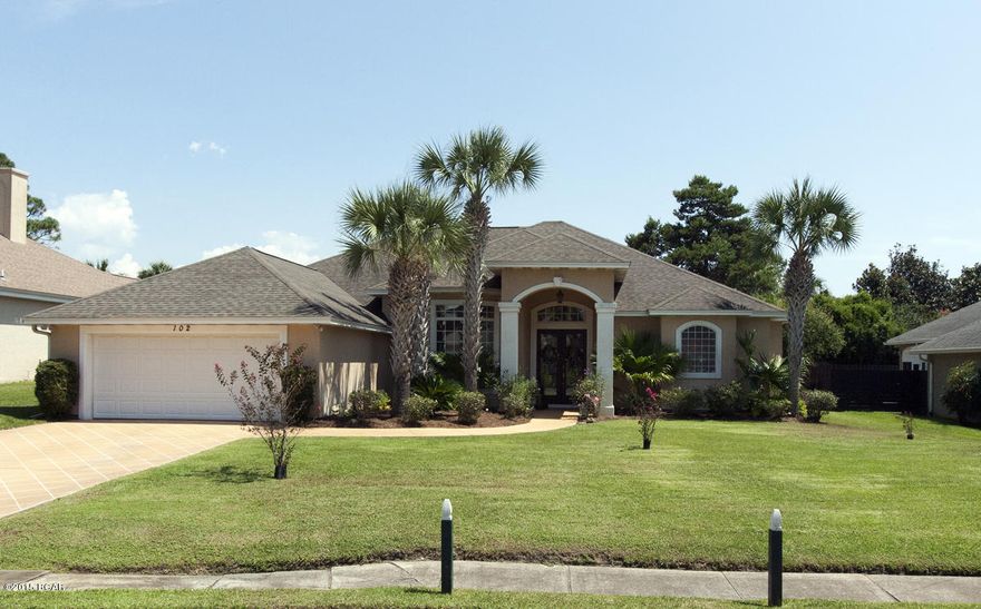 Exquisite home in the popular Palm Bay subdivision. This home is one of a kind with its own personal putting green and lush landscaping. The backyard is completely covered with the pool, fire pit, putting course and landscape. NO GRASS to mow in the back! The owners have went above and beyond with upgrades to the entertainment area. The inside living area features 12 ft. ceilings, arched walk ways and columns in the formal dining area. The master bath has plenty of room and a sitting area. There is a separate shower along with Jacuzzi tub. The Master bedroom has one of the best views in the home overlooking the pool and putting area. The carpet has been replaced and well taken care of. The sellers have added unique touches to the flooring such as custom tile work in the foyer and hallway.