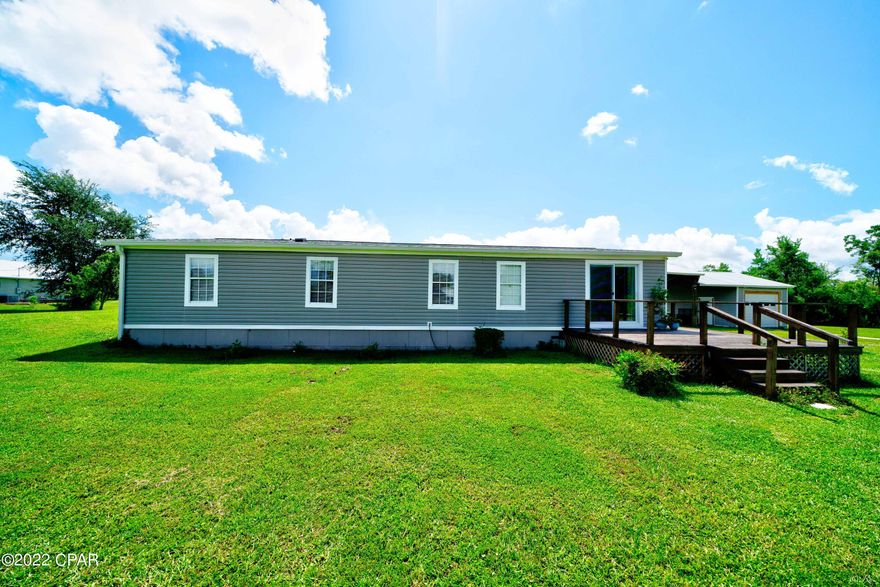 Come And Check Out This Beautiful, Remodeled, Quiet Home ON 3.4 ACRES back on the market! Just 30 minutes from Panama City Beach and Mexico Beach.  You Cant Beat This Much Land With So Many Amenities! Plenty of room for horses, gardening and other hobbies. Two Covered Carports For Boats and/or Rv's.. Detached Work Shed or Garage With Electrical Hookup! Half Wrap Around Porch, Partially Covered In The front/side With A Covered Patio.   Quiet dead-end road where Kids Can Play Safe! The possibilities are Endless With All This Land.  Engineering Foundation Certification is available: Tie Downs Are Updated, Completed And Approved! All New Plumbing Throughout! All Supporting Documents Provided! Must See Now, Will Sell fast!