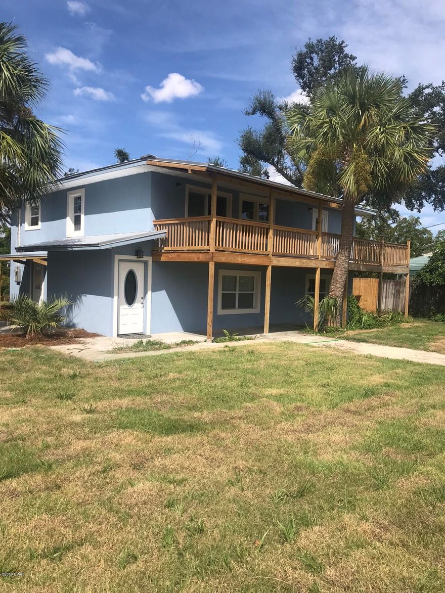 Completely remodeled 4 bedroom, 3 1/2 bath 2 story home in the heart of Lynn Haven.  Sit out on your balcony and enjoy the gorgeous views of Anderson Bayou.  Kitchen features slate appliances and solid surface counter tops.  Low maintenance luxury vinyl plank flooring and new carpet through out.