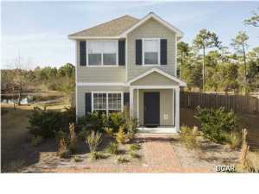 Best lot in Harrison's Walk! No neighbors behind you. Here's your chance to live less than a mile to the beach in the upscale neighborhood of ''Harrison's Walk'' for ONLY $200,000. When you pull into your new neighborhood you'll love the feel of the southern coastal style homes. This great home is less than 4 years old and in fantastic shape. The owner has taken very good care of it and it shows. The kitchen features granite countertops, designer cabinets, high-end appliances and tons of cabinet and countertop space. If you enjoy cooking you'll love the island as well. This very open floor plan is perfect for entertaining. You also have the brick paver pool area for grilling out and enjoying the company of your family and friends.This home is located on one of the prime lots in