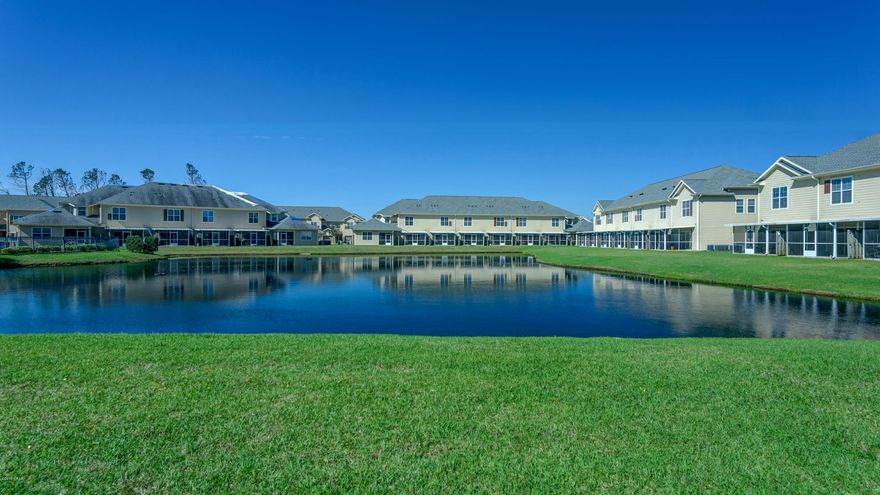 CURRENTLY UNDER CONTRACT, SELLER ACCEPTING BACKUP OFFERS . Lakefront Unit! Must see beautiful town home in gated community with pool and clubhouse amenities centrally located near Navy Base and Tyndall Air Force Base.  This 2 bedroom 2.5 bath features raised ceilings with crown molding. The Kitchen opens up to the dining room and living room and has granite counter tops, breakfast bar, pantry & lots of counter top space.  Just off the living room is a screened in back porch with the view of the lake & fountain.  A great place to relax. Upstairs has 2 spacious bedrooms, 2 baths & a  Bonus area! The Master Bedroom is generous & has a walk-in closet, Master bath has double vanity and shower/garden tub.  The additional bedroom has it's own private bathroom.