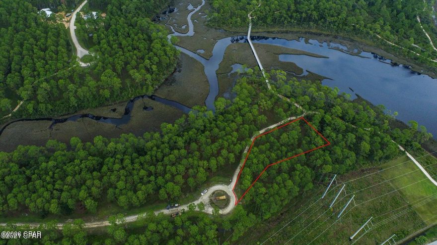 This is the perfect opportunity to build your dream home on a quiet cul-de-sac homesite, 3/4 of an acre, just steps to the vast community trail system, Crooked Creek and the community boat ramp. Rivercamps is unlike any other neighborhood in Panama City Beach. 1500 gated acres. Less than 450 homesites on 500 acres with the remaining 1000 acres committed to conservation. Nestled between the Intracoastal Waterway, Crooked Creek and West Bay, this gated community has so much to offer. Linked by over 7 miles of trails and boardwalks, the RiverCamps community offers outstanding amenities such as a zero-entry swimming pool, grill and pavilion, dry-boat storage, day use boat slips and a community boat ramp with direct access to Crooked Creek, West Bay and a 30-minute boat ride to the Gulf. Just 2 miles from RiverCamps Publix Grocery has broken ground and it has been announced there will be 450,000 sq. ft. of retail space coming. RiverCamps is located 10 miles from the famous white sandy beaches, 10 minutes from the NW Florida Beaches International Airport and a world away from the traffic and crowds.