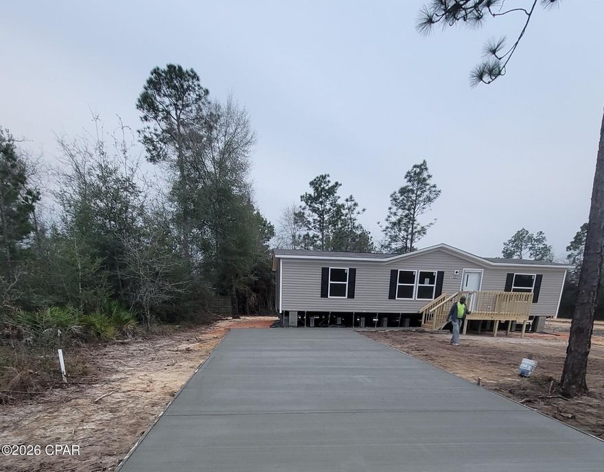 'CURRENTLY UNDER CONTRACT, SELLER WILL CONSIDER BACKUP OFFERS'.....Welcome to country living at its finest! This brand-new Wind Zone 3 manufactured home offers 1,264 sq ft of thoughtfully designed living space with 3 bedrooms and 2 full baths. Enjoy the peace and privacy of being just outside of town while staying close to everything Panama City has to offer — shopping, dining, hospitals, and the beautiful Gulf beaches. The open floor plan features modern finishes, spacious bedrooms, and a low-maintenance design, perfect for a primary residence, weekend retreat, or investment property.