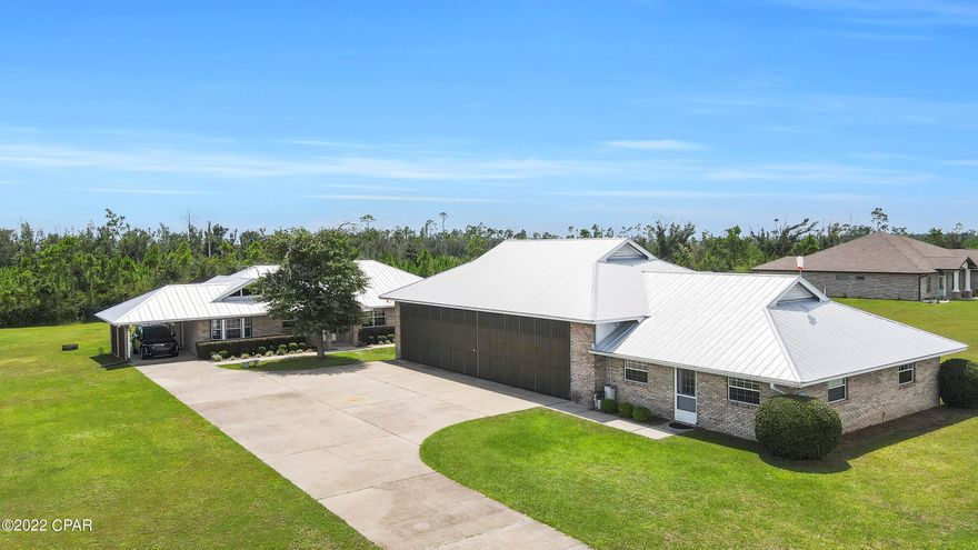 CURRENTLY UNDER CONTRACT, SELLER WILL CONSIDER BACKUP OFFERS - Dream Hangar Home Located in the Desirable Sandy Creek Airpark - Community features a private 3300' x 60' foot paved runway (9-27) & gated access for maximum privacy and security - Home features a 53' x 36' foot air-conditioned  hangar with a large office/man-cave, fenced-in pool & beautiful open concept living spaces w/ vaulted ceilings - Close proximity to shopping, dinning & Tyndall Air Force Base - 5 minute flight to the beach for the most unforgettable sunsets - This home will not last!