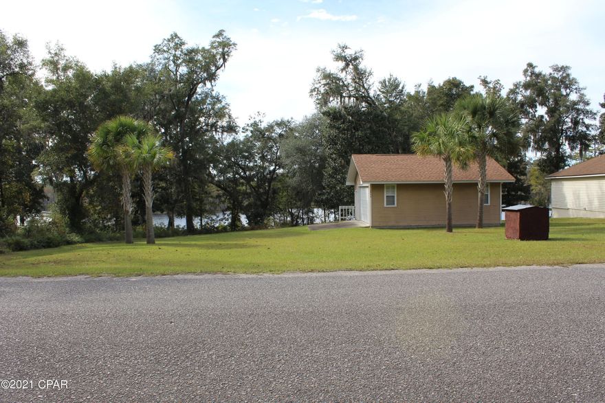 Features of this beautiful lakefront property include a garage with septic and water, bathroom, a lot and half that is prepped and ready to go for your home.  Gorgeous views of Dunford Lake and you will want to catch a sunset at the lake.  The neighborhood of Paradise Lakes wraps itself around Dunford Lake for pretty views, fishing and a boat ramp.  Call today to set up your appointment to view this stunning property.