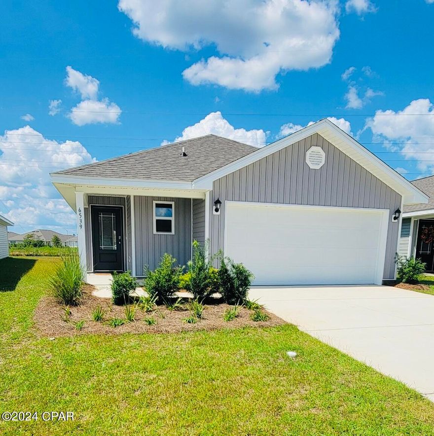 New Construction home in Liberty featuring the Jemison floor plan. This home is located at 6539 Atkins Road. This is a 3-bedroom, 2-bathroom home that is designed to optimize living space with an open concept kitchen overlooking the versatile family room. The well-appointed kitchen features an island with bar seating, oversized pantry and sleek stainless-steel appliances! Bedroom one is located at the rear of the home for privacy and has an ensuite bathroom with double vanity and spacious closet providing substantial storage space. A second bedroom and bath are located at the front of the home. Just off the kitchen the versatile third bedroom, perfect to meet your needs. Like all homes in Liberty, the Jemison includes a Home is Connected smart home technology package which allows you to control your home with your smart device while near or away. Liberty neighborhood is conveniently located in beautiful Panama City off Star Avenue near 231. Located just 25 minutes from Tyndall Airforce Base, 20 minutes to hospitals, and less than 15 minutes to shopping, restaurants, and grocery stores you will be amazed at the convenience once you enter the winding entrance to this beautiful sanctuary. Liberty offers a 7,500 square foot community center with full gym, wellness rooms and much more. Additionally, behind the community center is a water wonderland with resort style pool, splash pads, and an outdoor grilling kitchen with seating