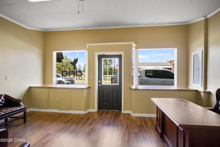 Main Street visibility � 5 rooms � 1 restroom � Desk + conference table + chairs included � 2012 interior remodel + roof � 2025 windows + new AC � Front and rear parking

Position your business on Main Street with strong storefront exposure in downtown Blountstown, Calhoun County. Located at 20735 Central Avenue East, this vacant commercial building offers five flexible rooms plus one restroom, ideal for offices, a shop, or a service-based workspace. A desk, conference table, and chairs are included with the sale, supporting a smoother setup from day one. Recent improvements include a 2012 interior remodel and roof, plus 2025 window updates and a newly installed and replaced AC system. Convenient parking in front of the building and behind it supports customers, deliveries, and staff. A practical footprint, a central address, and updated systems make this space ready for your next chapter.