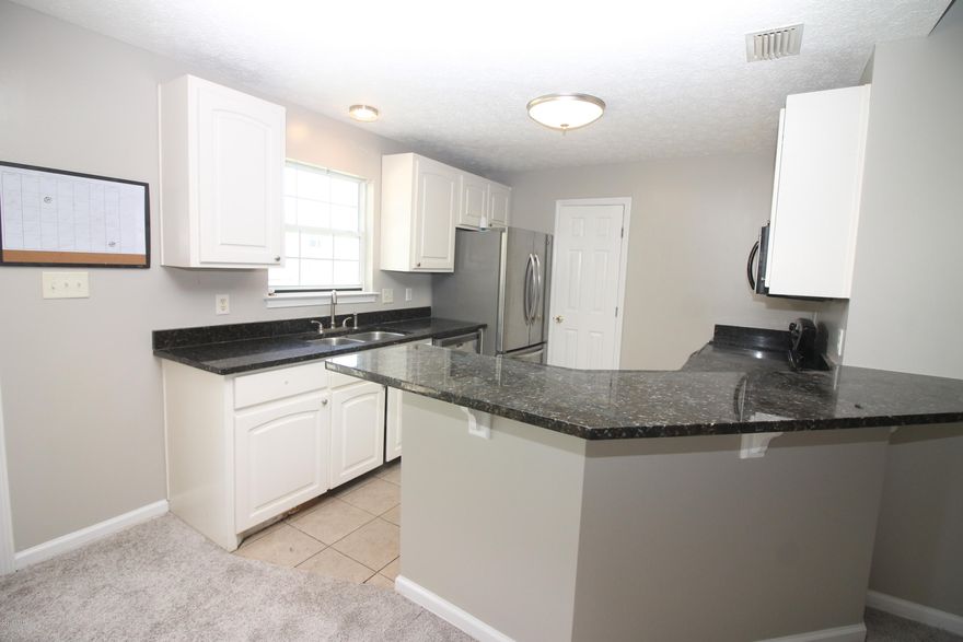 CURRENTLY UNDER CONTRACT, SELLER ACCEPTING BACKUP OFFERS  Beautiful home in Hidden Pines, THis home has new paint throughout, new carpet throughout, and priced right, the home has fenced back yard, updated kitchen with large pantry, stainless steel appliances and granite counter tops. This home will not last, close to NAVY base and east side of Panama City Beach it is one of the most sought after neighborhoods on the beach