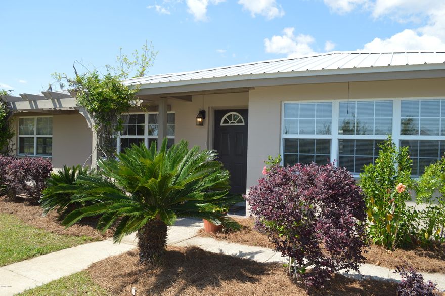 'CURRENTLY UNDER CONTRACT.  MOVE IN READY! 3 bedrooms, 2 full baths, office (or nursery) off the master, and a bonus room! Almost 1/2 acre on a gated corner lot with pool, brick paver patio, walking paths, fire pit, outdoor shower, and an oversized detached garage or workshop. You even have your own citrus grove!  New metal roof, new fence, new pool pump, gorgeous bamboo floors, gas range, security system and a gas powered whole house generator are just a few of the features. The new refrigerator and pool liner are on the way to complete this already great home.  This concrete block home stood up to the hurricane, and due to the generator, never even went without power or water. Close to Tyndall, school, neighborhood park, and a short distance to the water!