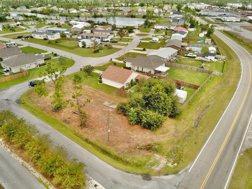 Lakefront Community. Lot about 1,000 feet from lake. Underground utilities, county water and sewer available. End lot paved on 3 sides. Very nice neighborhood.

Amenities include fenced in spring fed lake with white sandy beach,  to enjoy kayaking, canoeing, paddle boating, fishing and swimming on long hot summer days. Party Pavilion/Gazebo, play ground, volley ball net, BBQ grill and picnic area. Buyer will receive a code for this private lake as part of the Association.