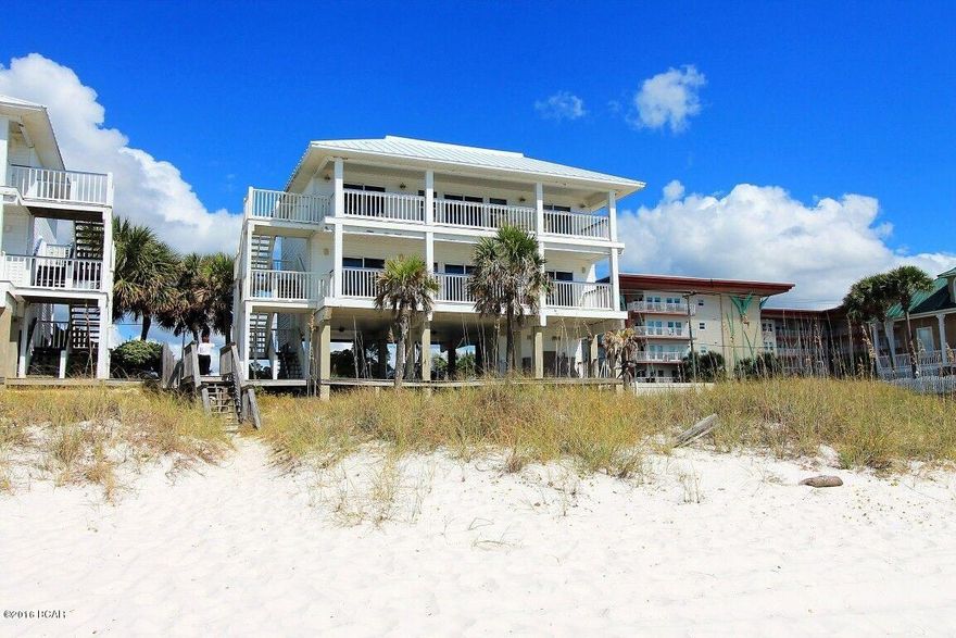 2nd Floor Beach Flat. NO condo fees or Homeowner Association. This is a fee simple unit of a duplex on the beachfront.  Well maintained GULF FRONT 3 bedrm 2 bath home with amazing beautiful balcony views of the beaches, gulf, sunrise, sunsets, dolphins, boats and ships passing!  Rich life, beach life, salt life!  This 2nd flr Flat is walking distance to Toucan's, groceries, & seafood!  Don't miss this opportunity to own a slice of beach front in a hot location of Mexico Beach's finest!  Fully furnished, turn-key, vacation rental with active income & clientele, history of generous $34--35k annual income.  Of course you can keep the unit for yourself if you are seeking a primary or second home on the GULF OF MEXICO. Call today to set up a showing. Roof new in 2012. All offers appreciated.