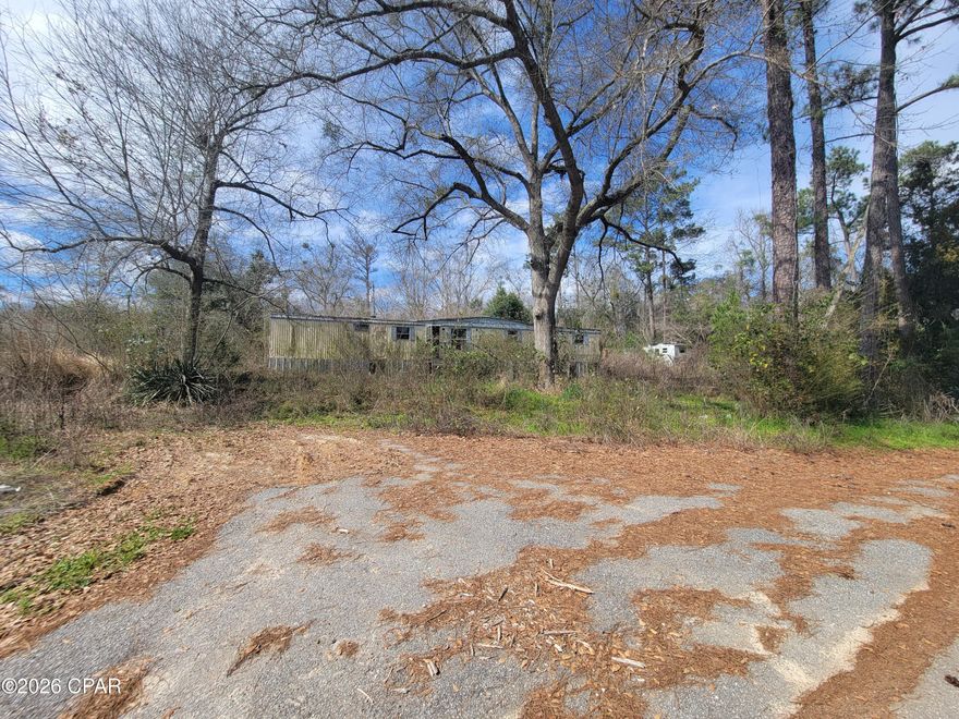 Investment opportunity with strong potential! This mobile home park features 10 units situated on a quiet dead-end road just minutes from town in Marianna. None of the units are currently in livable condition, offering a blank slate for redevelopment, renovation, or repositioning. Property includes one large well and five septic tanks already in place. Prime location combined with existing infrastructure creates numerous possibilities for investors or developers looking to add value.
