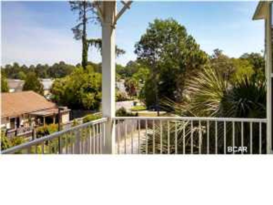 Experience an oasis at the beach. This is an executive 1 bedroom, 1 bath, 1069 sq. ft. condo with a study/office in the beautiful and tranquil gated community of Island Reserve, located off Front Beach Road in Panama City Beach. This open floorplan features hardwood flooring in the living area, tile in the kitchen and bathroom, and plush carpet in the bedroom and bonus study, all with 10' ceilings. The well appointed kitchen includes granite countertops and island, stainless steel appliances, and detailed cabinetry. Bonus amenities include washer and dryer, window coverings, private balcony and covered garage parking and entry. The Island Reserve community features gorgeous landscaped courtyards with paved walks and fountains. Club house boasts fitness center, media center,