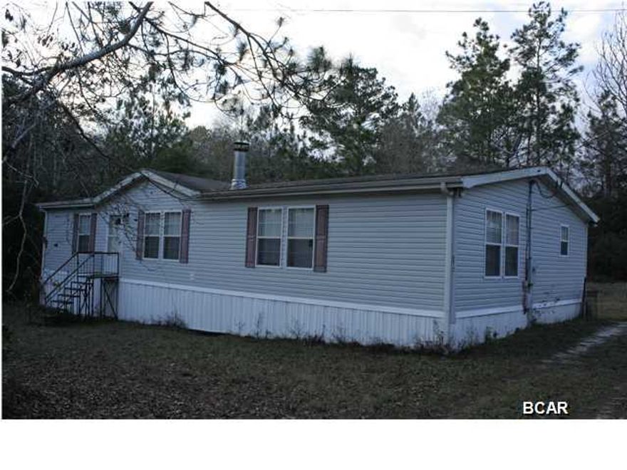 Approved Short Sale opportunity in Bear Creek. Double wide modular mobile home with large deck, split bedroom plan, open living area with wood burning fireplace. Eat in kitchen offers Whirlpool appliances, smooth cook-top, built in microwave, built in oven, side by side fridge, vent hood and a kitchen island. The master bedroom has an office/bonus room. The master bath has double vanity, garden tub, separate shower, water closet, large his-n-hers walk in closet with built ins. Inside laundry room and storage just off kitchen. Guest bedrooms have large walk-in closets. This is a must see property.