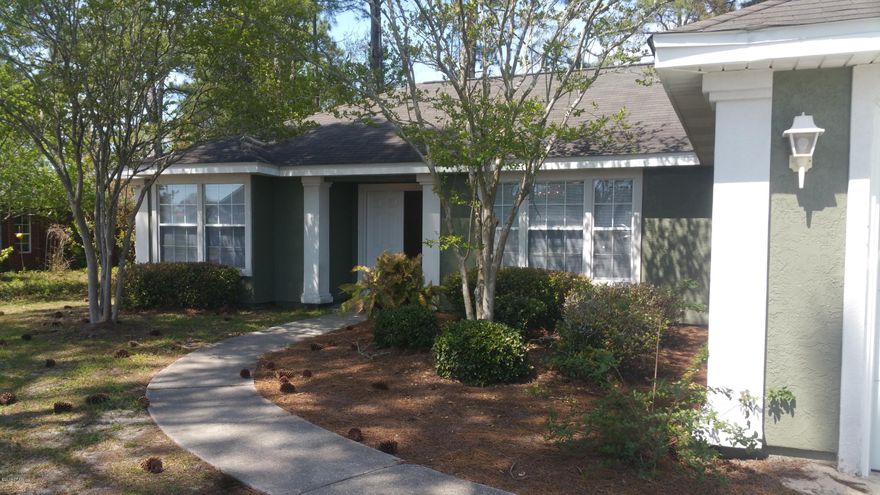 Conveniently located 3 bedroom 2 bath with 2 car garage. Large open living area with fireplace, formal dining room. Door leading to concrete pad in back. Kitchen has a breakfast nook, pantry, some custom cabinetry  and all appliances. track lighting, raised and tray ceilings. Laundry room has storage and connects to the garage w attic storage and shelving. Hurricane plywood is in garage already cut to fit.