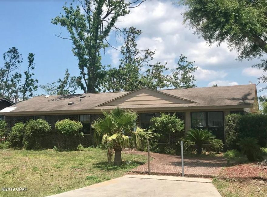 Three bedroom brick home on a large corner lot in Lynn Haven near the Country Club. This home boasts a two car garage and tile throughout. Minimal hurricane damage and move in ready. Property is being sold as is.