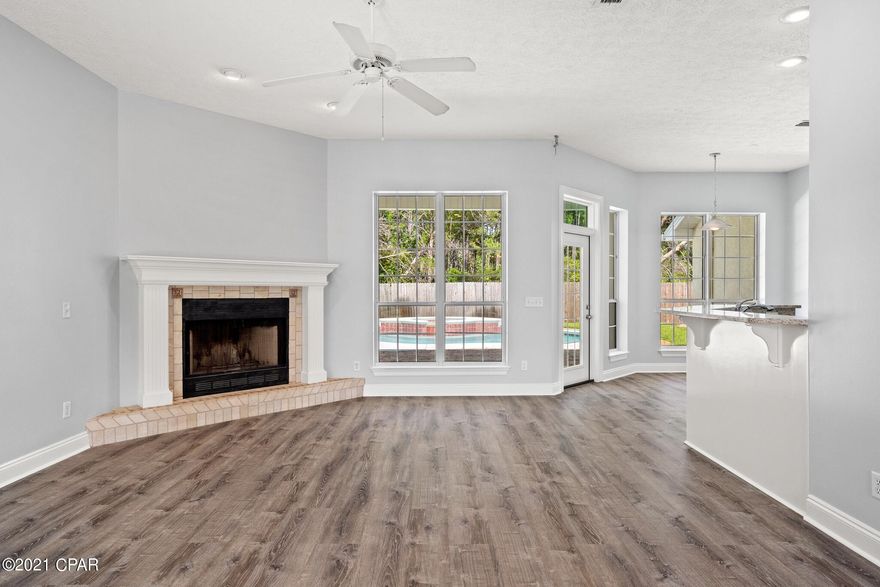 ***5 BD, 2BA HIDDEN PINES HOME...WITH A POOL AND SPA!!!*** Sellers have done a lot of renovations to include a 2019 roof, new ''life proof'' vinyl plank flooring, granite countertops, newly painted inside & out, power washed and repainted pool deck/porches, pool filtration system, hurricane shutters, ceiling fans and a wood burning fireplace. Spa spills over into the pool, and pool comes equipped with color changing lights. Newly painted kitchen and bathroom cabinets, recessed lighting in great room, new kitchen faucet, master bedroom has a tray ceiling and master bath comes with a garden tub, separate shower, and dual sinks. Irrigation system is fed by a well. Sellers to provide a transferable home warranty. All information is approximate and should be verified by buyers if important