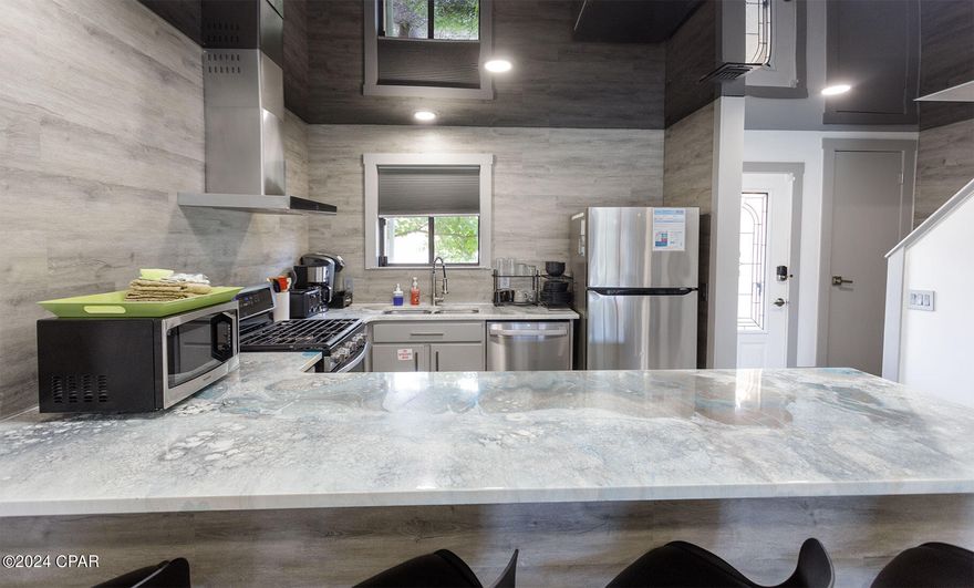 UNDER CONTRACT- SELLER TAKING BACK UP OFFERS

Welcome to Gulf Highlands Beach Resort, a beloved destination offering coastal living and resort-style amenities. This inviting ''Glassback'' townhome features 2 bedrooms, 2 and a half bathrooms, all completely remodeled with unique, modern finishes. Inside, discover a tastefully upgraded space with contemporary vinyl flooring throughout this unit and sleek tile flooring in both bathrooms. The entire home has been remodeled from top to bottom, including a new roof in 2020 and new A/C in 2024. Fully furnished with stylish, contemporary interior furniture, this unit ensures convenience and relaxation. Residents enjoy access to resort amenities, including 11 pools (5 heated), tennis courts, mini-golf, a fitness room, and a clubhouse with a snack bar. Ideal as a second home or an investment property in a vacation rental program, this townhome offers a glimpse into the upscale Gulf Highlands lifestyle. Schedule a showing today to experience modern coastal living firsthand.