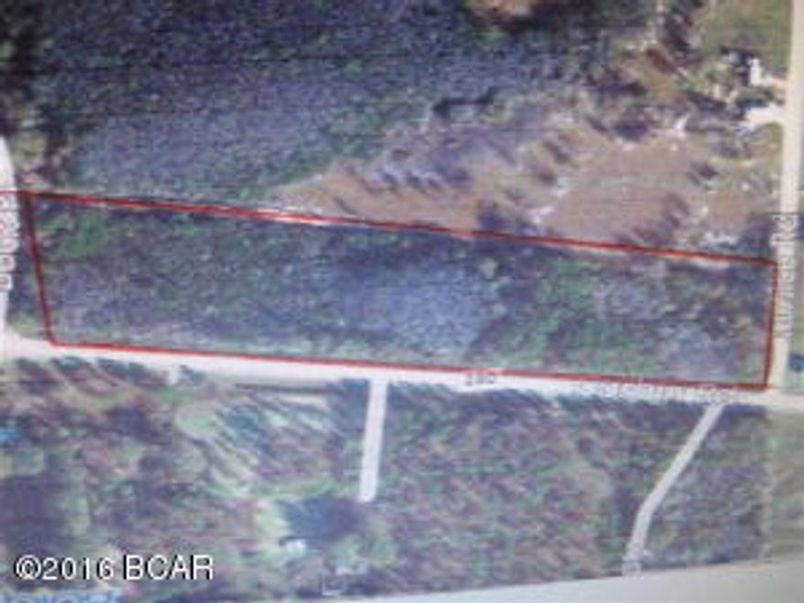 9 acres wooded unimproved land, some wetland and some pine trees. Over 1/4 mile highway frontage on Corbin Road. Not restricted.