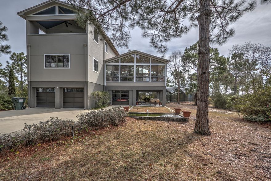 All sizes are apx taken from seller or property tax records///W-A-T-E-R-F-R-O-N-T AT ITS BEST!!! Over 8 acres of waterfront--home is surrounded by East Bay--intra-coastal waterway is very close!!!Great fishing and very private///large boat house/dock with space for large 40 plus trawler/sail boat storage or a smaller boat with lift///deep water that will go to the bay and the Beautiful Gulf of Mexico!!! All the amenities--elevator, 3 car garage, 2 sided fireplace--enclosed heated pool--Viking gas range/cooktop--convection oven--halogen microwave--(dream kitchen)---wine cellar---workshop--If water means something this home is it---beautiful views both morning and evening!!! A Must to see!!!!Nothing will compare!!!Owner may consider owner financing with large down payment!!!!!! short balloon----