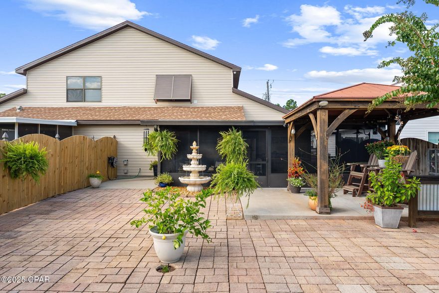 This beautifully updated 3-bedroom, 2-bathroom home features a private master suite on the second story, offering a true retreat while blending comfort, efficiency, and functionality throughout. Inside, you'll find stylish LVP flooring, wide baseboards, and a cozy electric fireplace in the living area. The kitchen is designed with granite countertops, a pantry with pull-out drawers, and updated appliances for both style and convenience. Both bathrooms showcase quality finishes and thoughtful design.

Energy-saving enhancements include lifetime insulated windows, upgraded attic insulation, solar-powered attic vents, and a generator transfer switch helping you save money while staying prepared.

Outdoor living is equally inviting with a 12x12 covered patio with ceiling fan over a concrete pad, a large screened-in patio with ceramic tile and concrete coating, a 10x12 covered golf cart parking area, and a 10x20 wired workshop. The fully fenced backyard provides privacy, while decorative white vinyl fencing adds curb appeal in the front. A WiFi-controlled sprinkler system keeps the lawn lush and green, and the 220V hookup is ready for a hot tub, and Security System for comfort.

Located in the heart of Lynn Haven, this home truly has it all modern upgrades, energy efficiency, and incredible indoor and outdoor living spaces.