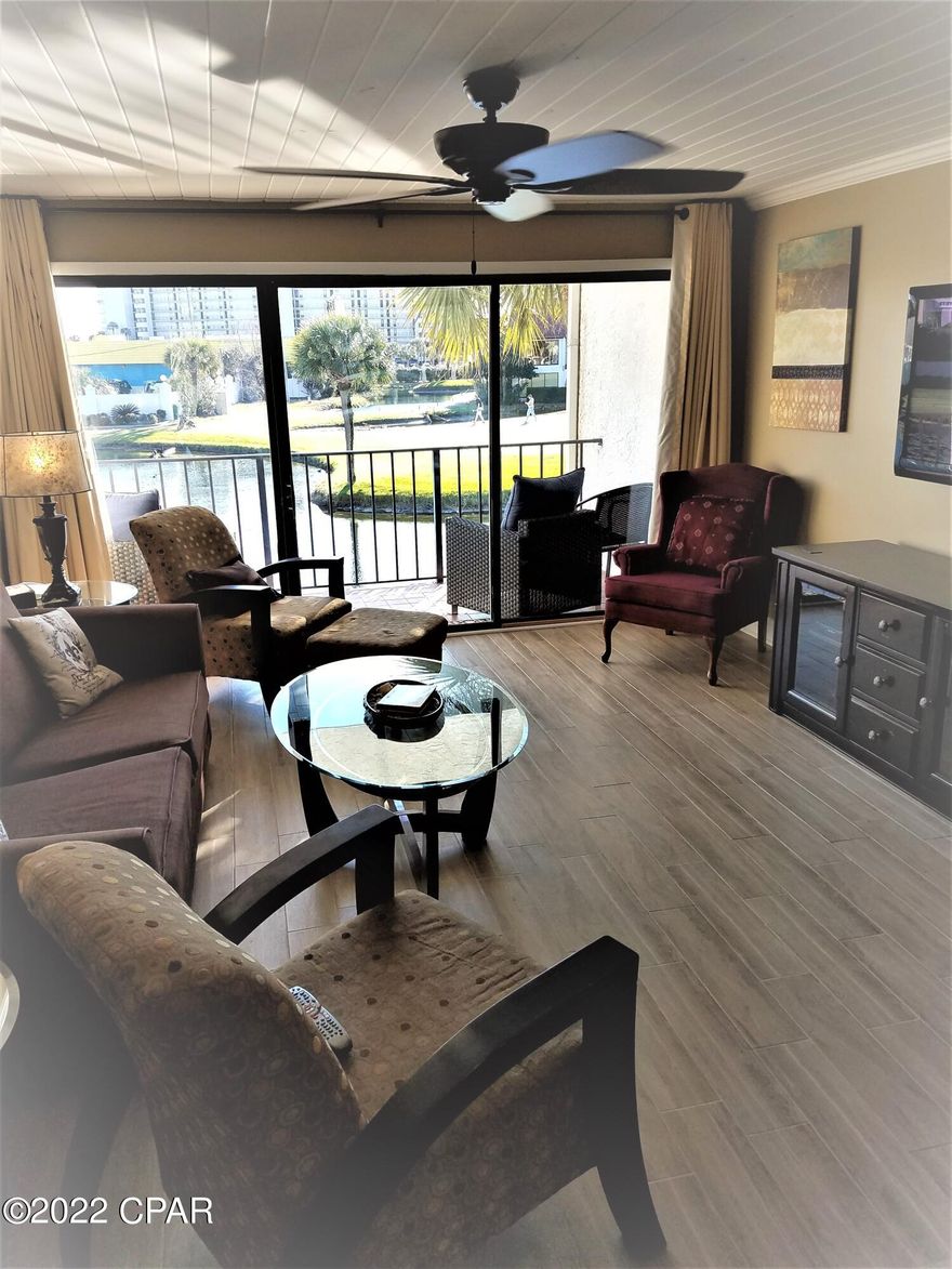 'CURRENTLY UNDER CONTRACT, SELLER ACCEPTING BACKUP OFFERS'  Absolutely Beautiful 2 BR unit with 3 Full Baths in Edgewater Golf Villa Building 1. On the 1st Level you have a Gorgeous Remodeled Kitchen with Granite & Stainless Steel Appliances, Full Bath with Walk-in Tile Shower & a Super Cool Sink, Dining Area & Bar Seating at the Kitchen Counter, Nice Size Living Area that opens up to the Balcony that Overlooks the Water & Golf Course. The Upstairs has also been Totally Updated. The Main Bedroom has 2 Closets and a Balcony that overlooks the Water & Golf Course, the Main Bathroom has a Beautiful Walk-in Shower, Vanity, and Tile Plank floor. The 2nd BR is also Large enough to hold 2 SETS of Bunk Beds and 2 Closets. The Guest Bathroom also has a Walk-in Shower. It won't last!!