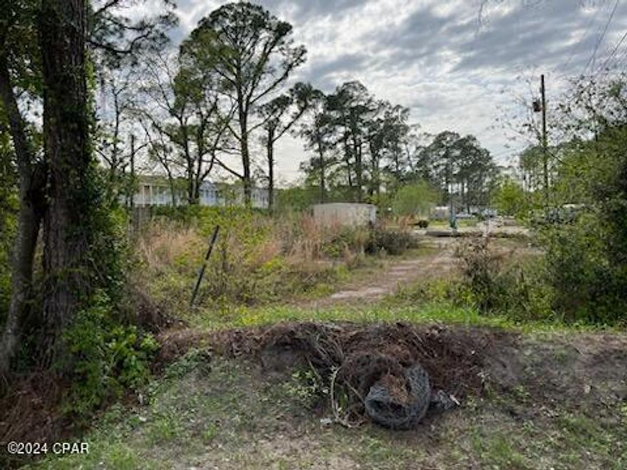 Fabulous lot for small residential development, just west of the Hathaway Bridge off of Front Beach Road, quiet dead end street. Great location, and easy access.       Seller has engineered plans in place consisting of site work and also for 8 Townhomes.