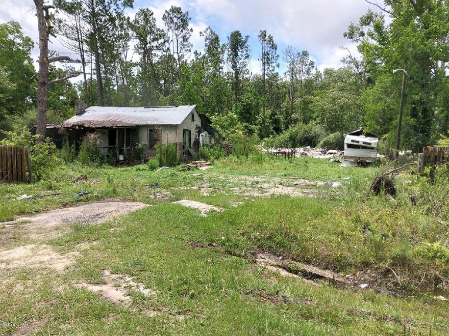 THIS HOME WAS SEVERELY DAMAGED BY THE HURRICANE.  USE CAUTION!!!  SEPTIC TANK EXPOSED AND NEEDS TO BE REPLACED.  HOME MAY BE SALVAGEABLE....BUYER AND AGENTS MUST SIGN HOLD HARMLESS TO ENTER THE PROPERTY.  VALUE IN THE LAND. ROOM SIZES, SQUARE FOOTAGE AND AGE OF HOUSE ARE APPROXIMATE.
