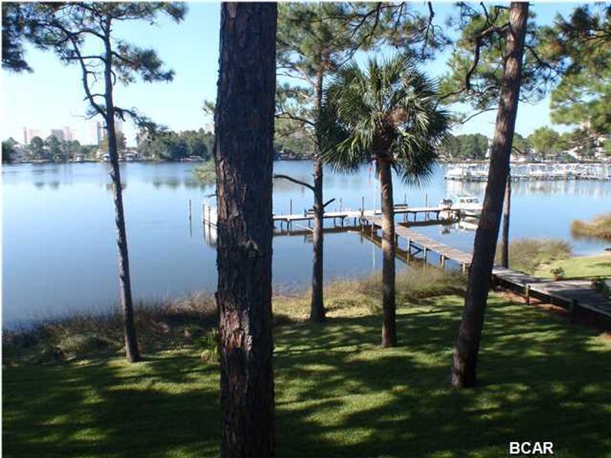 THE VIEW IS WHAT IT'S ALL ABOUT!! Totally updated with carpet, paint, a/c, and appliances. Boat slips when available lease for $50 per mo. Owner also has 2 two Bed Room water front units for sale at $116,900. #52 in same complex and #29 in Palisades. Note: Seller is an active Fla. Real Estate Broker.