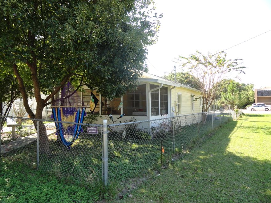 This one bed, one bath plus bonus room is roomy for it's size.  Would make a great home or investment property.  Roof was redone in 2005, Kitchen was remodeled a few years ago with granite countertops and tile backsplash.  There is laminate flooring throughout and newer AC system. Kitchen has a gas stove, Kenmore refrigerator and microwave. There is also an interior laundry room.   The yard is completely fenced in and there is a driveway in the front of the home and a driveway with carport in the back of the home.  There is also a large shed that can be used as a workshop or for storage that has plumbing and electric running to it. The bonus room can be a second bedroom. The front sun porch is great for relaxing on. Subfloors need some work done to them