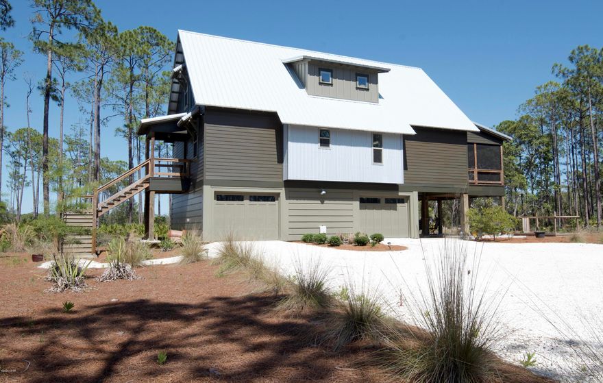 Tranquility at its best! This beautiful 3BR 3B home is located on a large lot with impressive views of Crooked Creek and a short ride to the beaches. When you enter the gate at Rivercamps you will immediately see this exceptional St Joe planned community is special! It is loaded with  amenities including a community pool, boat ramp, day docks, boat storage, playgrounds, walking trails, camping, gym, and abundant outdoor activities such as bikes and canoes for homeowners use. The community is nestled between Crooked Creek, West Bay, and the intercoastal waterway. Besides the amazing old Florida views this home also boast marble countertops, shiplap, tile shower, solid core doors, and chef kitchen.