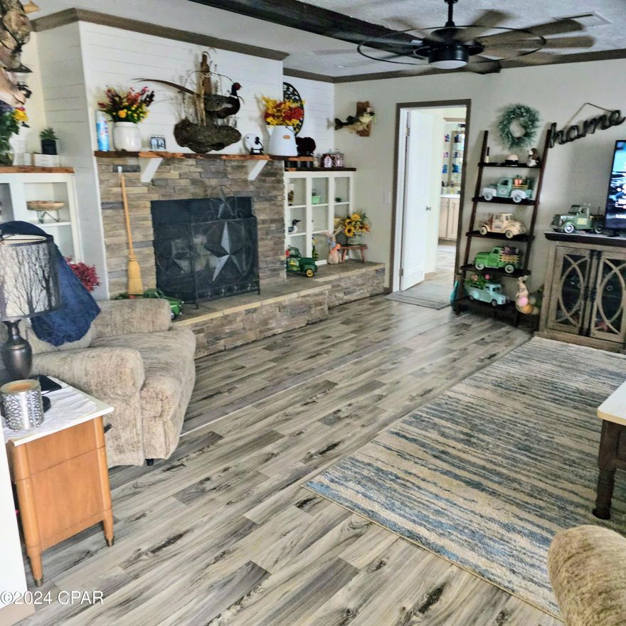 Exquisite Countryside Retreat at 12850 Pitts Road

Step into the comfort of this 2432 sq ft sanctuary, a newly installed manufactured home that exudes elegance and meticulous care. With three bedrooms and two bathrooms, this residence is a testament to high-end living in the heart of Fountain, Florida.

Masterful Living: The home's crown jewel is the expansive master bedroom, complete with an en-suite bathroom featuring a large soaking tub, separate shower, and a spacious walk-in closet. It's a private haven designed for relaxation and rejuvenation.

Open Concept Grandeur: The heart of the home is the open concept family room, kitchen, and dining area, where high-end appliances and custom fixtures blend seamlessly with fresh paint and refined aesthetics. It's the perfect setting for family gatherings and entertaining guests.

Outdoor Oasis: The property includes two storage sheds and a substantial 24x25 enclosed pole barn on a concrete slab, ideal for hobbies or storage. Sustainability is key with a new septic tank and a well-protected by a covered house, ensuring modern conveniences are at hand.

Nature's Bounty: Set on a generous 3.87 acres, the grounds are a gardener's dream, featuring ready-to-use planters and newly planted fruit trees. The surrounding greenery and local wildlife create a serene backdrop for this idyllic home.

Location Perfection: Located with easy access to Panama City Beach, two neighboring states, and freeway access, this home offers the perfect blend of rural tranquility and convenient connectivity.

This property is more than a home; it's a lifestyle waiting to be cherished by those who seek quality, comfort, and a touch of luxury amidst nature's beauty.